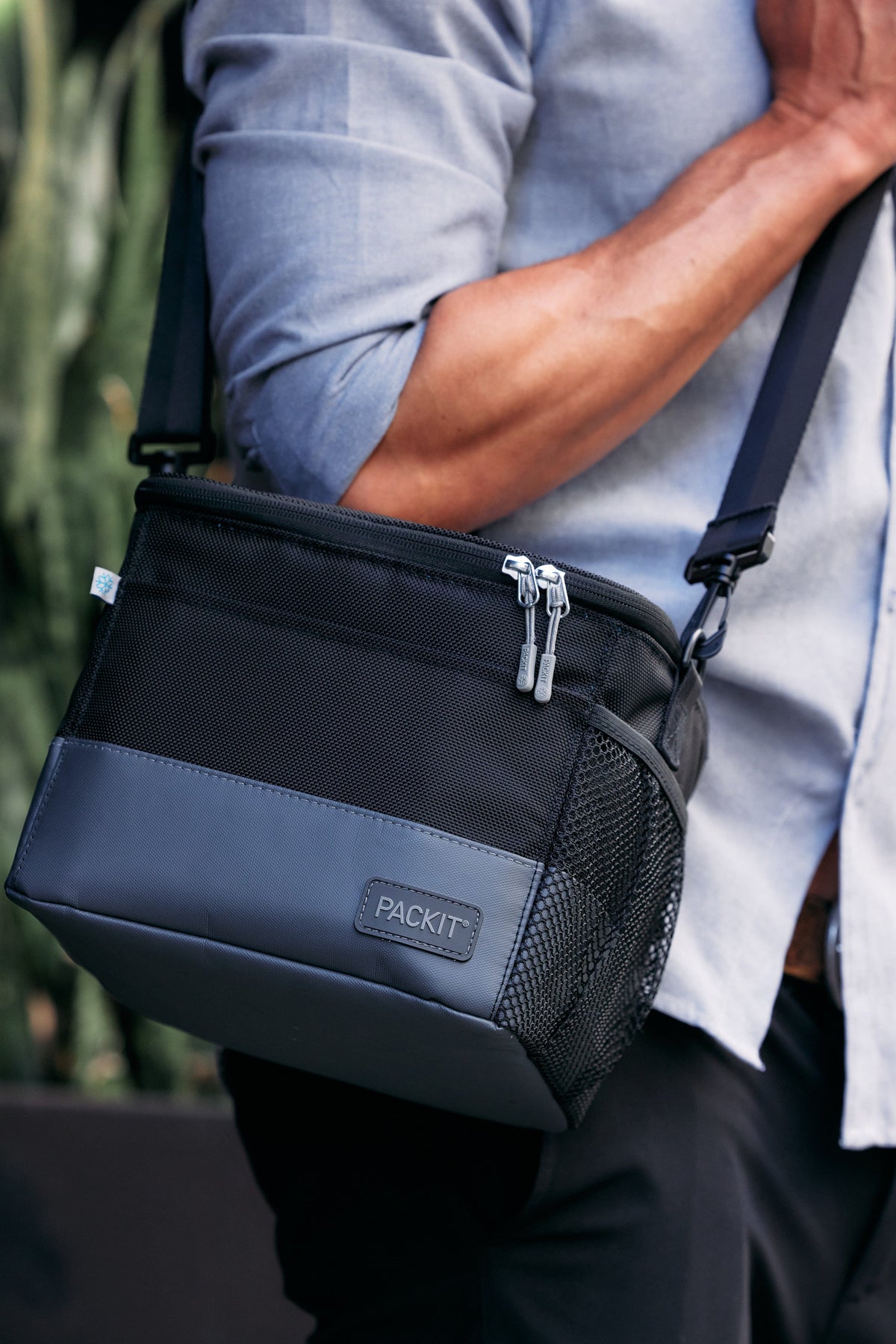 freezable-lunch-pail-l7 freezable-upright-lunch-pail-black-gray-lifestyle-male-city.jpg